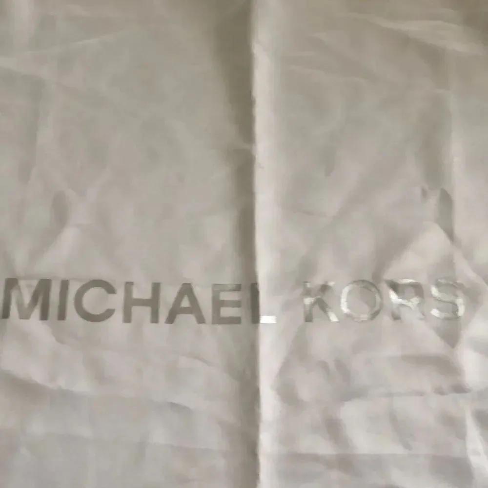 Michael Kors Silky beige large dust bag.